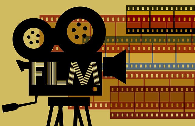 Cartoon of an old school film camera shooting out colored strips of film