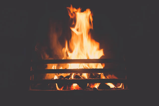 A warm fire place waiting for you and your cuddle buddy.