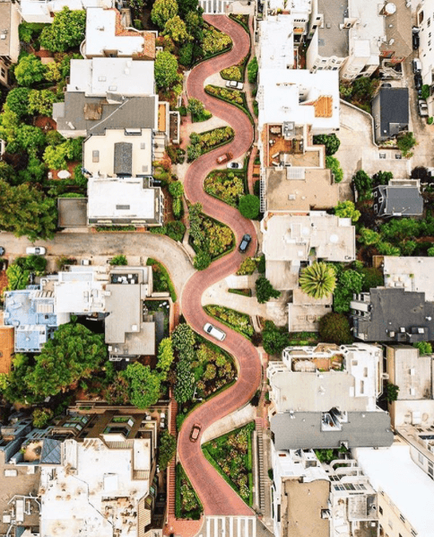 visuals of life instagram picture of street, houses and cars