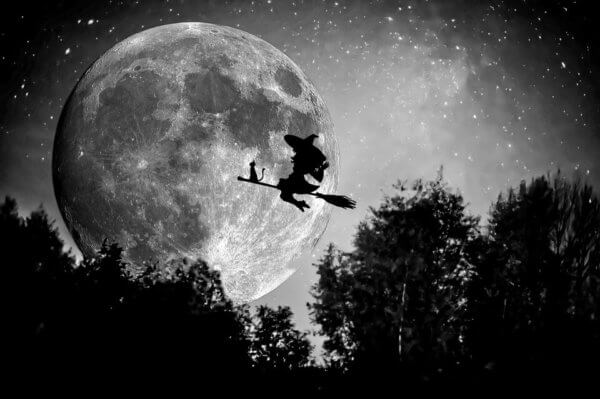 witch on broomstick in front of moon osu general education classes