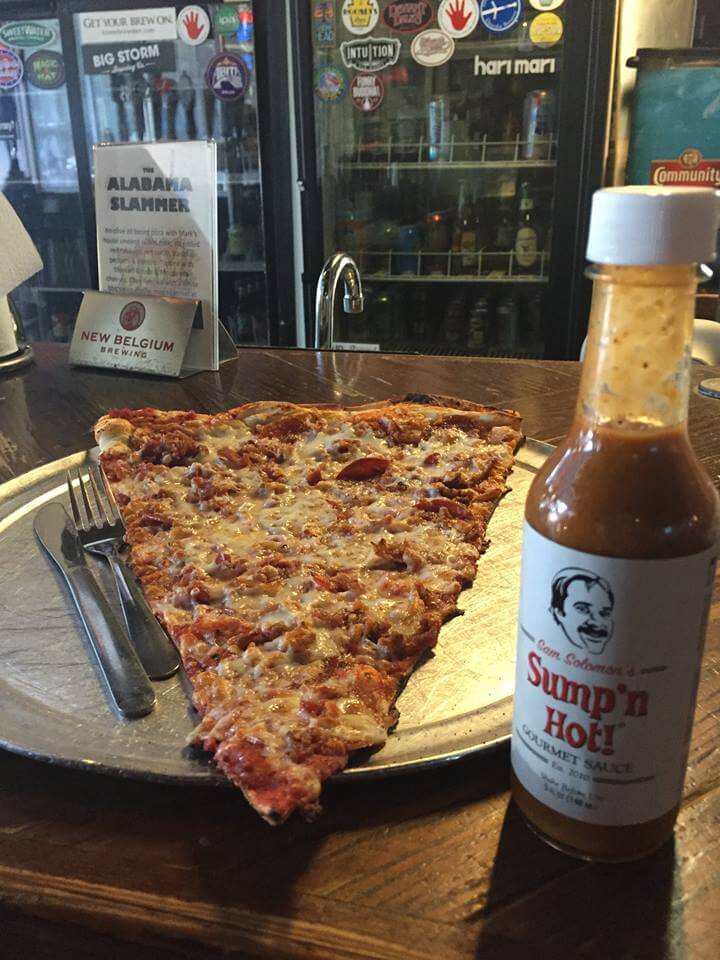 Eat a pizza slice as big as your head at Momo's.