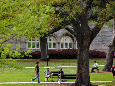 students walking across the Tulane University campus
