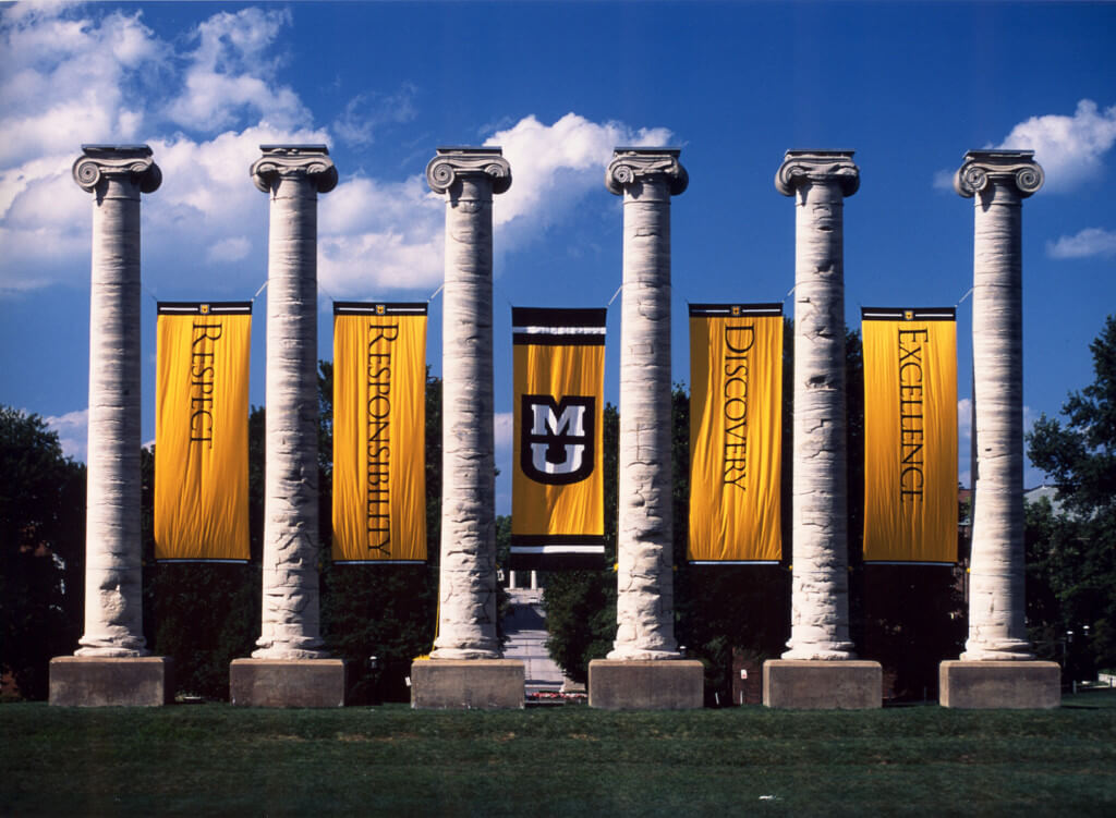 The Mizzou columns look impressive against a clear blue sky.