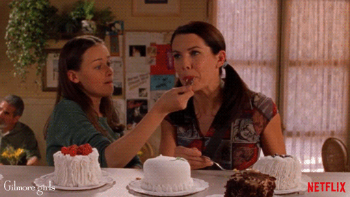 Lorelai and Rory eating cake