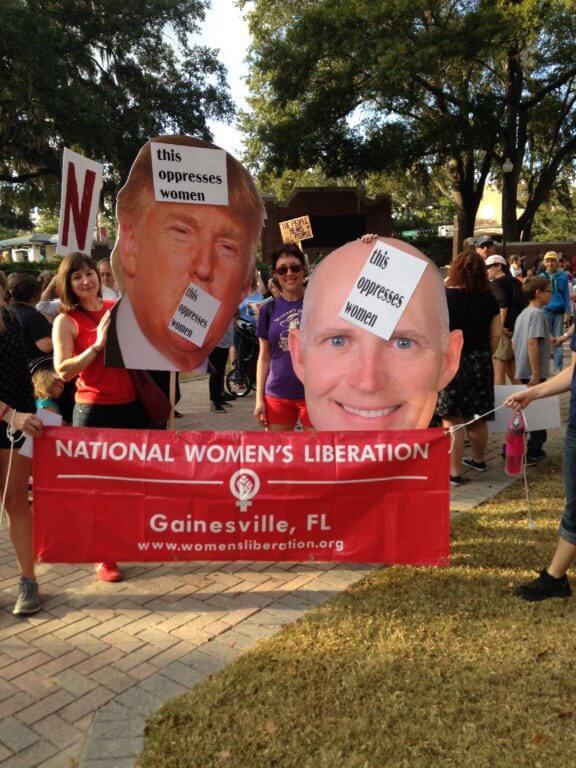 Trump and Scott posters at the Women's Lib protest in Gainesville.