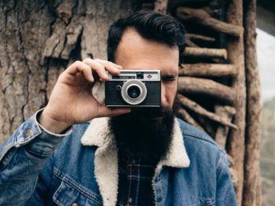 Hipster friend with beard taking a picture