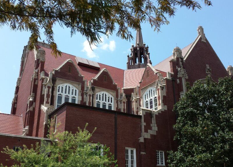 The rooftop of the University of Florida peeking through the trees in Gainesville.