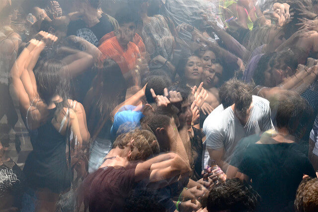 People dancing in a crowd in The Vault nightclub in Gainesville. 