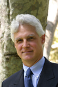 This picture shows Prof. Ian Krouse from University of California Los Angeles (UCLA) in a suit in front of a tree.