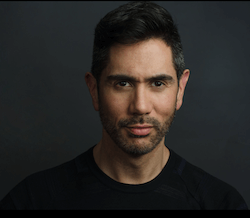 This picture shows Jeremy Aye from New York University (NYU) in a black T-shirt against a dark background.