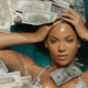 Beyonce in a pool of money