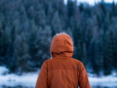 Person standing outside in snow during winter break