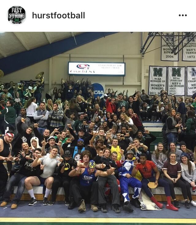 Mercyhurst football players at a basketball game