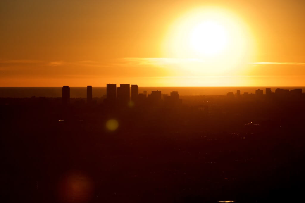 the sun sets over the city