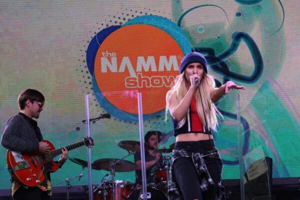 Performers singing at the NAMM Show. 