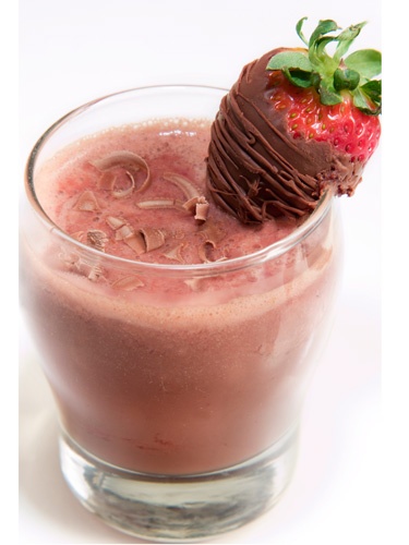 Galentine's Day drink with a strawberry and chocolate 