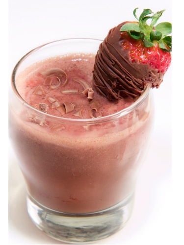 Galentine's Day drink with a strawberry and chocolate