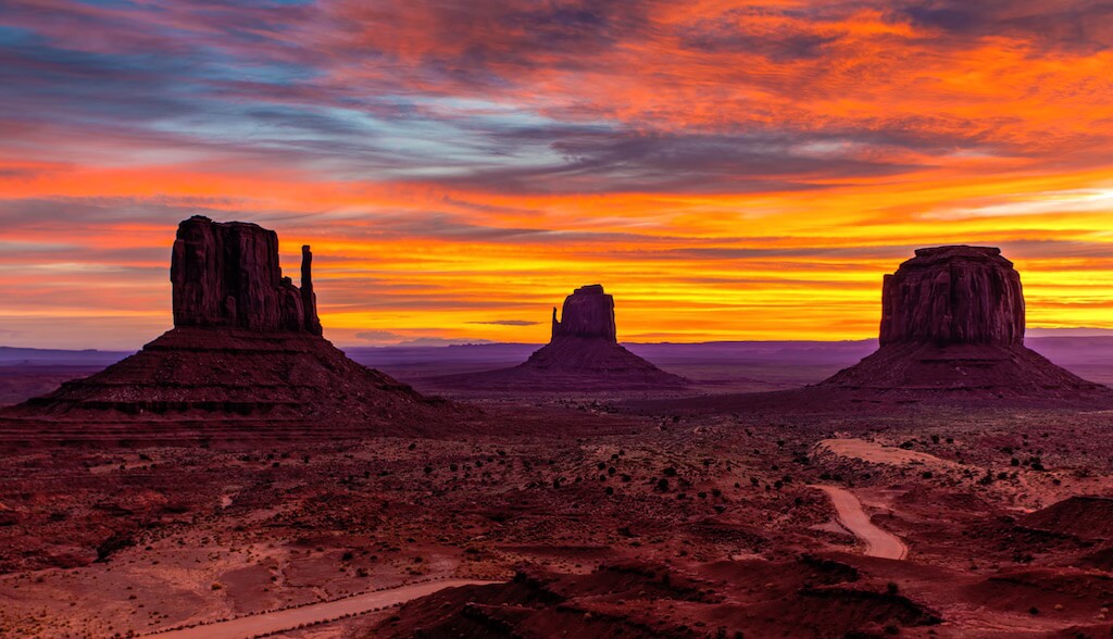 Ride through Monument Valley and sleep in Navajo mud huts.