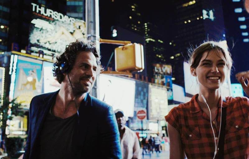 The characters are listening to love songs that won't make you barf.