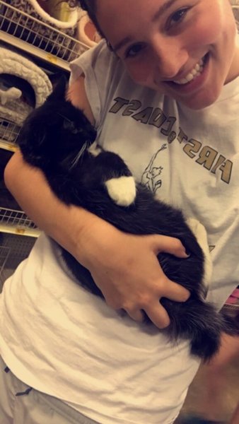 UF student holding a cat at Petsmart