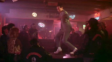pee wee herman dancing on a bar table