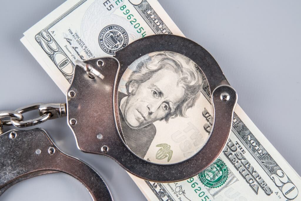 handcuffs and money