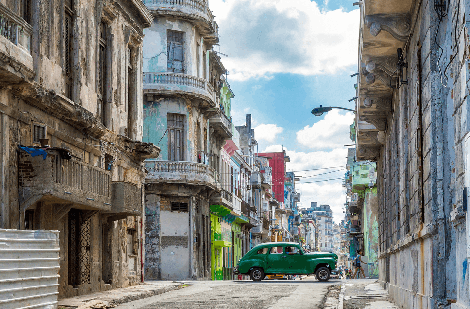 Old-school car drives through Havana, Cuba