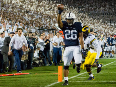 Saquon Barkley holding one of the touchdowns at the PSU Whitout Game against Michigan in 2017.