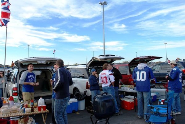 Penn Staters enjoying a day out in the sun, tailgating. 