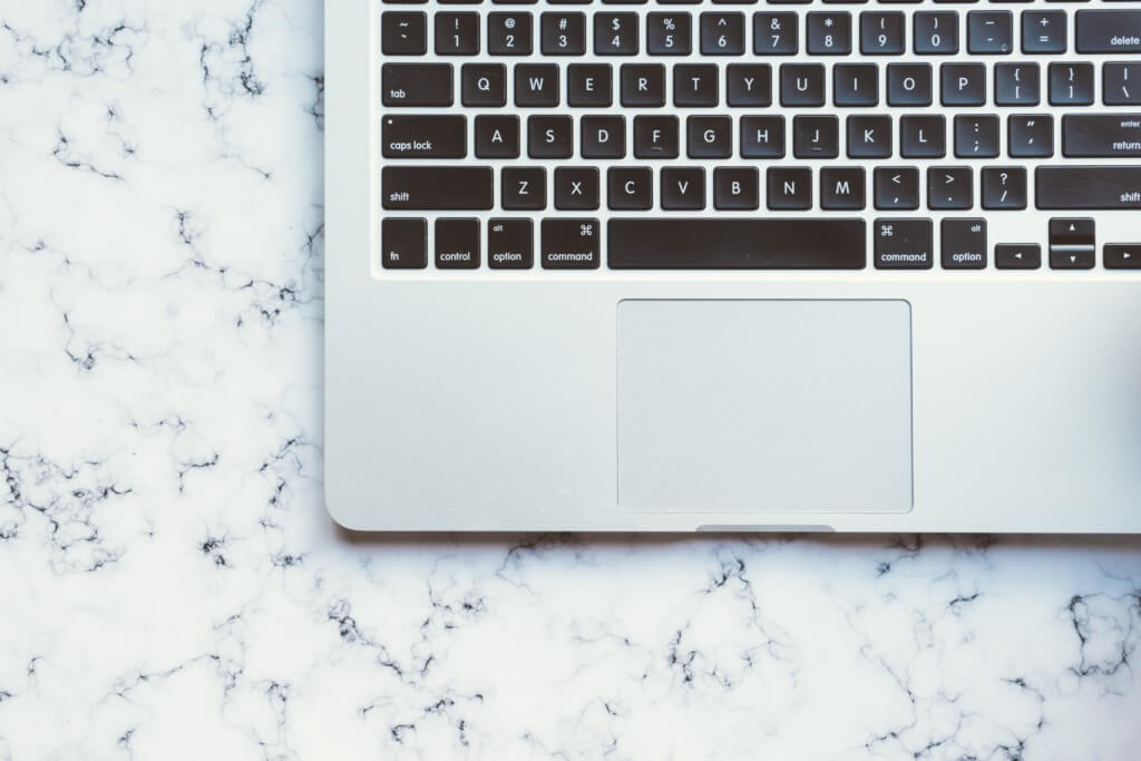 Overhead View of Laptop on Marble