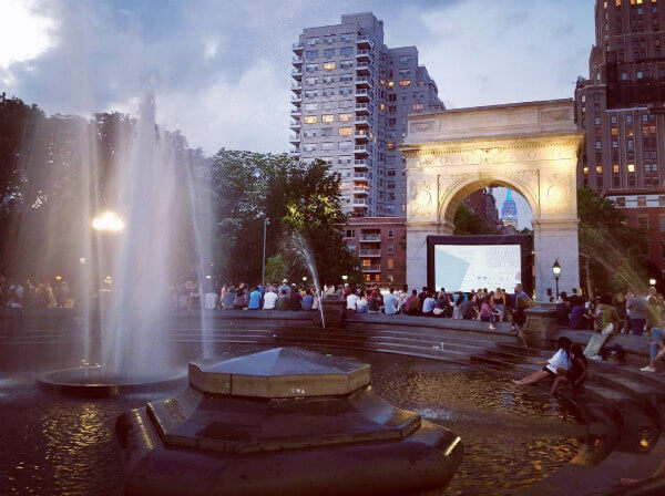 Films on the green and the classic Arc de Triomphe.