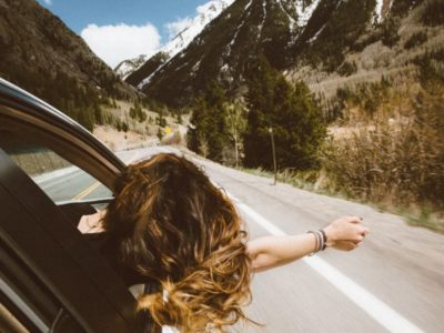 Girl Sticking Out of Car Window