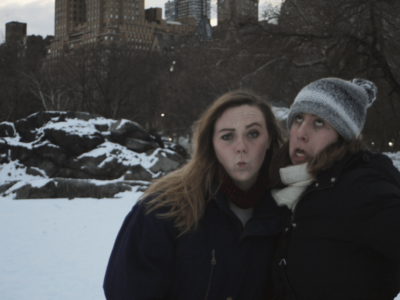 two girls making faces in the snow