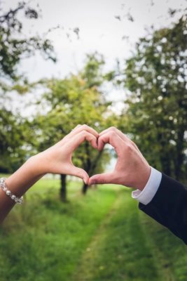 How to ask a shy guy out-two hands forming a heart. 