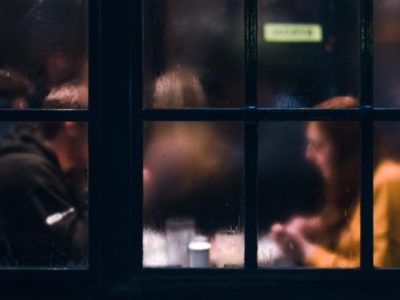 couple through a window