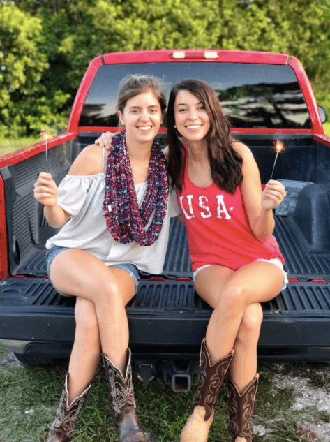 eight siblings sisters in pick up truck