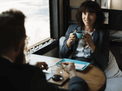 woman in blue blazer listening in an interview