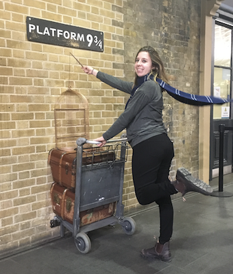 girl at Platform 9 3/4 with a blue scarf and a wand money exchange