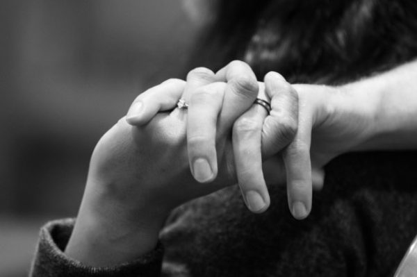 man and woman holding hand