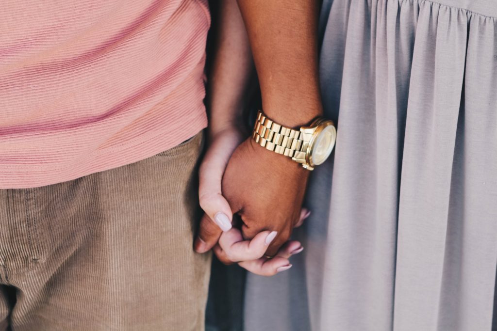 guy and girl holding hands