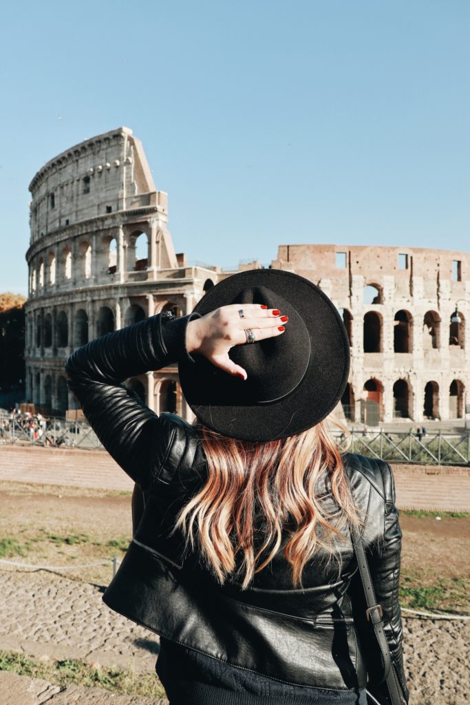 Girl looking at colosseum 