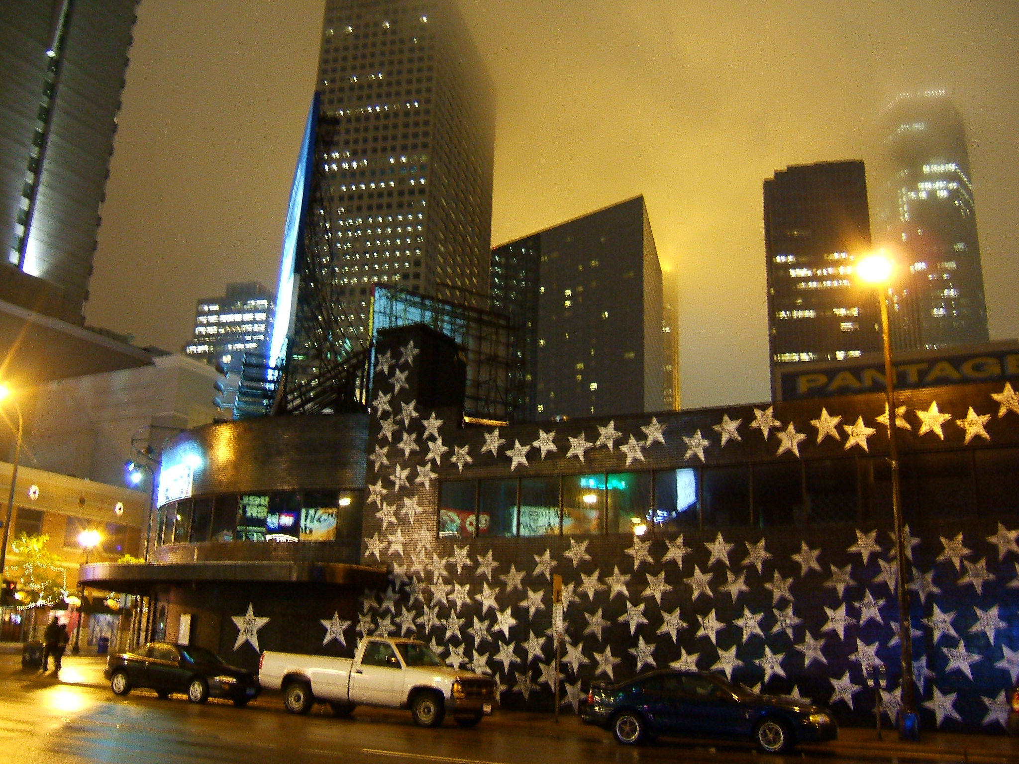 Outside of First Avenue at night with skyline in backdrop