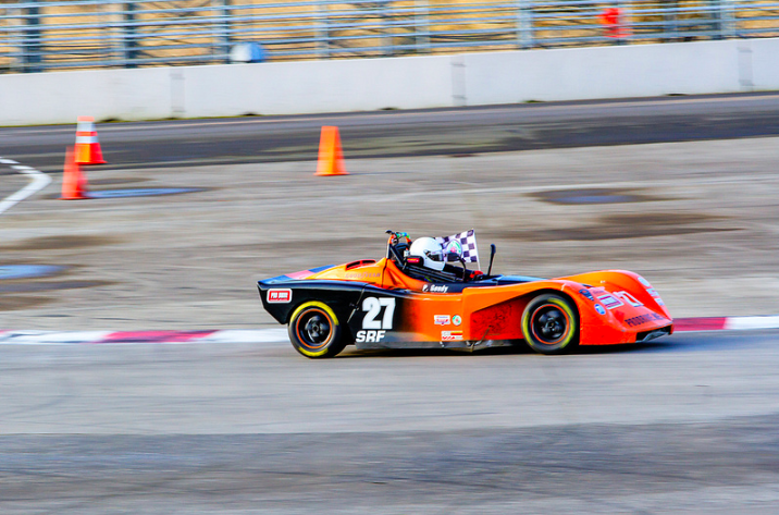 red race car on track portland