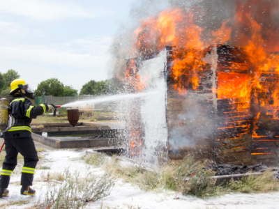 Firefighter putting out fire