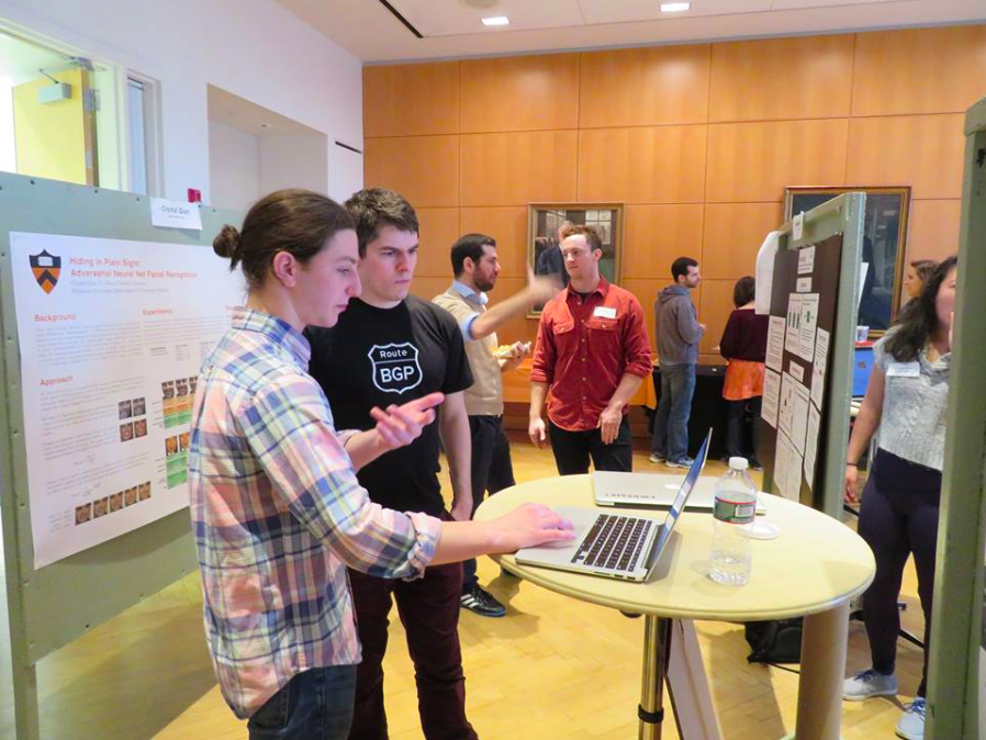 students explaining computer project