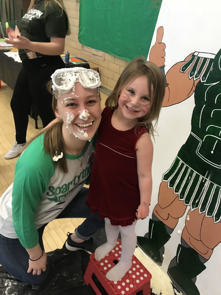 spartython pie face with little girl smiling