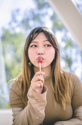 Sarah Chi eating a lollipop