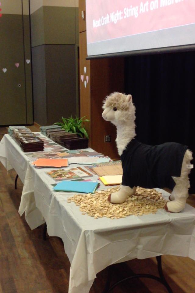 craft night table with llama stuffed animal