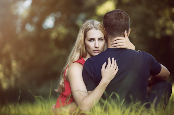 Woman clinging to man dating in college