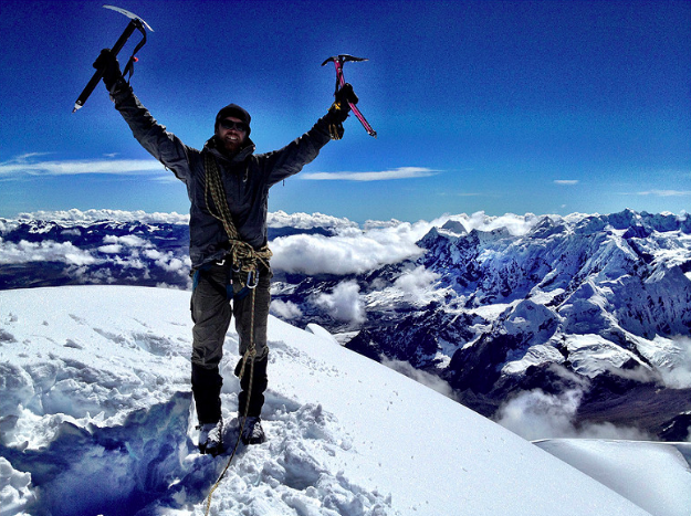 man hiking in snow millennial generation